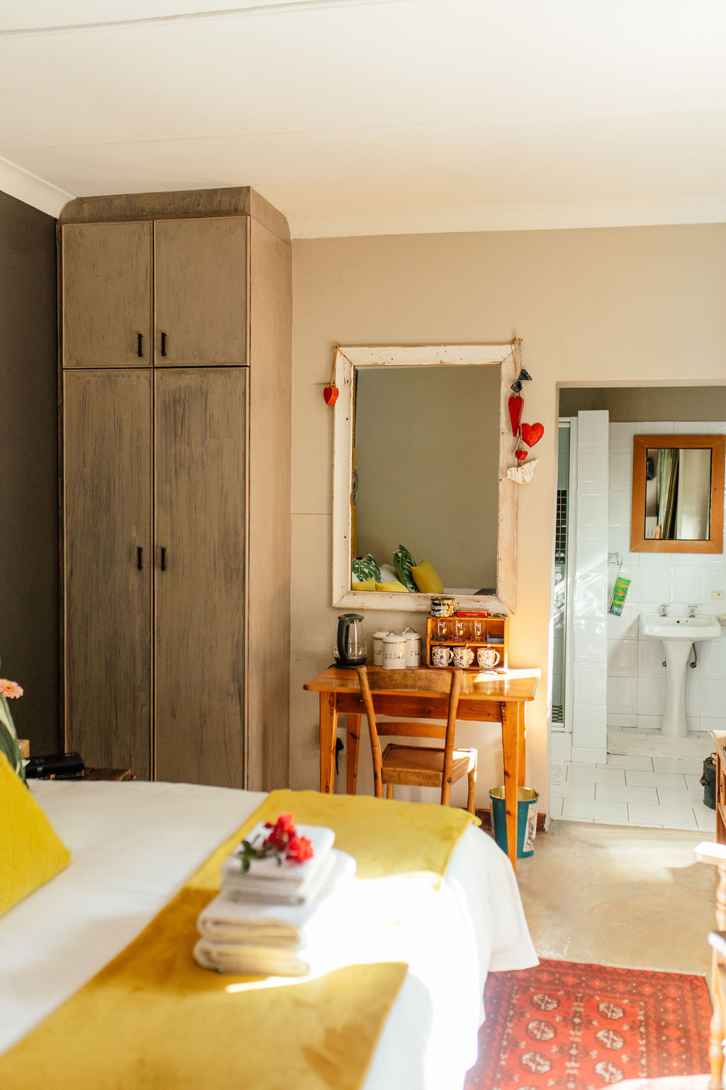Bed, wardrobe and en suite bathroom in a room